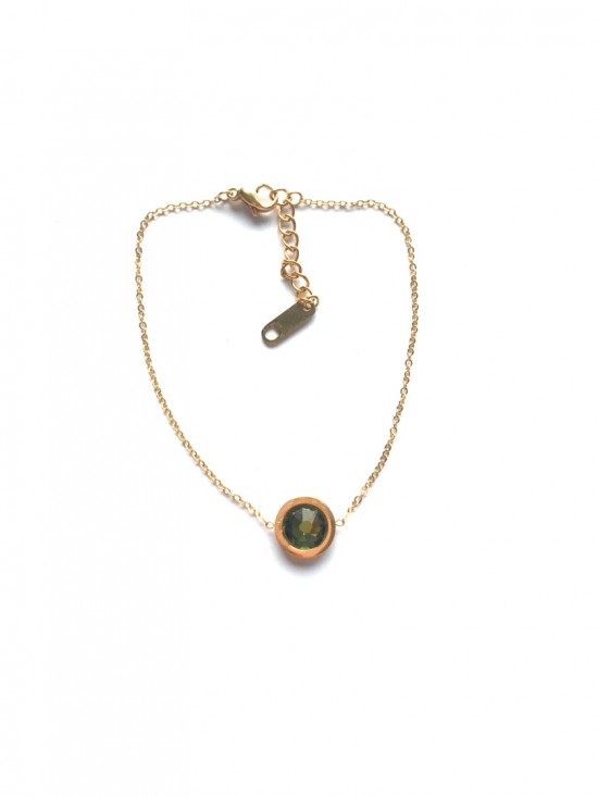Gold bracelet with green diamond