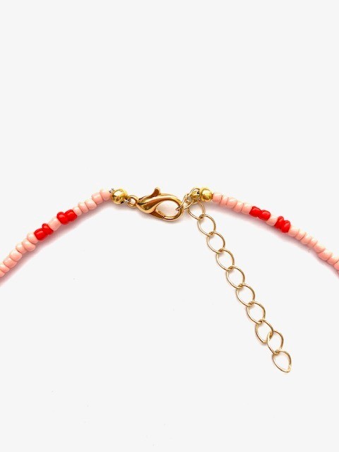 Pink necklace with 3 shells